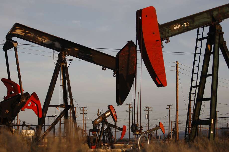 Pump jacks and wells are seen in an oil field on the Monterey Shale formation where gas and oil extraction using hydraulic fracturing, or fracking, is on the verge of a boom on March 23, 2014 near McKittrick, California.  Photo: David McNew, Getty Images